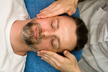 Fototapeta na wymiar Facial massage for man