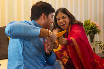 Sibling having fun on Raksha Bandhan