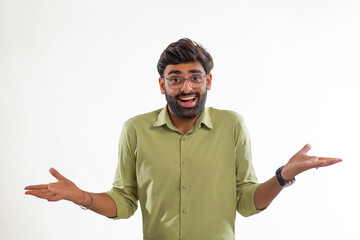 Fototapeta premium Portrait of a smiling young man gesturing against white background
