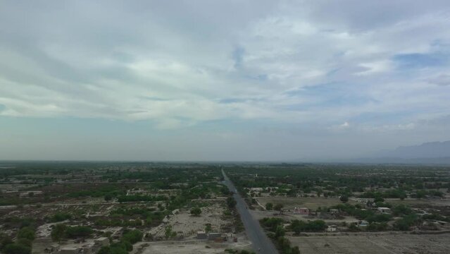 Aerial timelapse of cars driving on RCD Road in Balochistan
