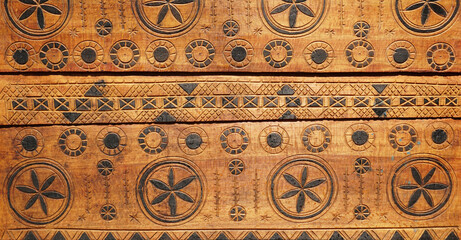 Wooden carving surface of old chest with ornament
