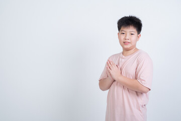 boy praying on white background