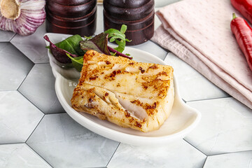 Roasted cod fish steak with salad