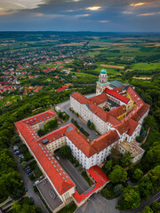 Pannonhalma, Hungary - Aerial panoramic view of the beautiful Millenary Benedictine Abbey of Pannonhalma (Pannonhalmi Apatsag) with blue sky and green foliage at summertime