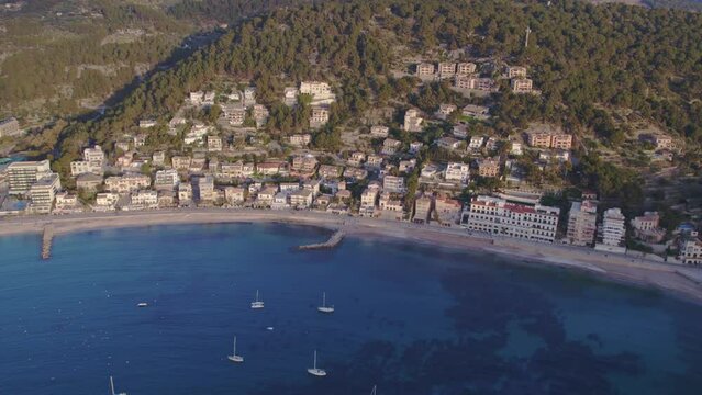 Aerial view of Port de S&oacute;ller Mallorca with docked sailboats during sunset
