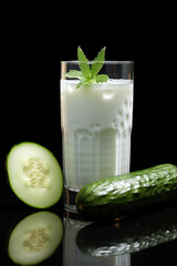 Glass of milk with fresh cucumber