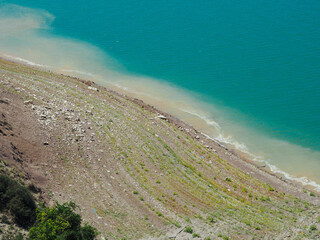 mountain reservoir with stunning blue water surrounded by mountains