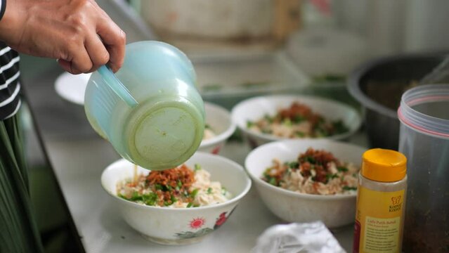 Chicken Porridge Seller Or Tukang Bubur Ayam Is Prepares His Meal For Customers Or Pelanggan. Bubur Ayam (Chicken Porridge), Malaysian Traditional FooChicked Consist Of White Rice Porridge With Salted