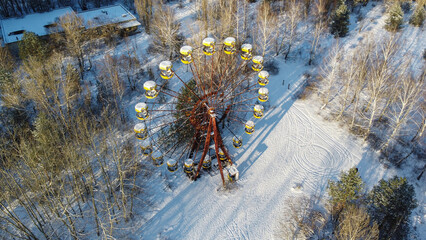 Aerial view of ferris wheel in amusement park.