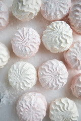pink and green marshmallows close-up. apple and strawberry marshmallow top view. large marshmallows macro	