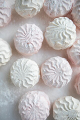 pink and green marshmallows close-up. apple and strawberry marshmallow top view. large marshmallows macro