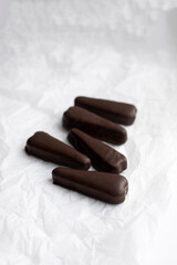 sweets in chocolate glaze close-up. chocolate sweets on a white background.