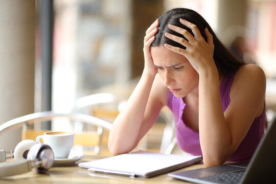 Worried student trying to memorize a lesson in a bar