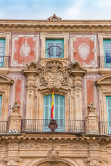 Fototapeta na wymiar Balcony and windows on the historic episcopal palace in Murcia, Spain
