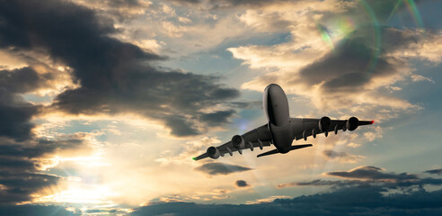 Passenger commercial aircraft flying above the clouds in sunset light.