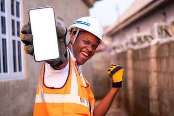 Excited african engineer holding smartphone with blank screen