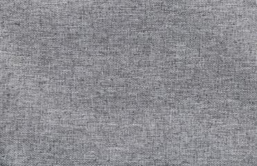 Fototapeta na wymiar Grey color denim jeans fabric texture. Horizontal or vertical light gray denim background
