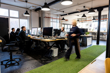 Business colleagues working on computer in office