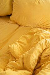 Morning in bed. The bedding is orange