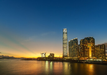 Fototapeta na wymiar Skyscraper, skyline and harbor of Hong Kong city at dusk