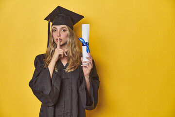 Young caucasian woman wearing a graduation robe holding a diploma Ykeeping a secret or asking for silence.