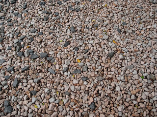 Gravel is composed of unconsolidated rock fragments. Gravel texture background. Pile of small pebbles.