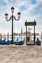 Fototapeta na wymiar Gondolas in Venice, Italy at sunrise.