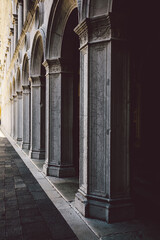 Fototapeta na wymiar Ancient columns with arches at Palazzo Ducale or Doge's Palace in Venice, Italy