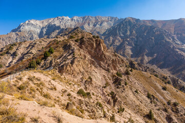 Fototapeta premium View from above. Mountain landscape of the South of Uzbekistan. Beautiful high mountains in autumn. Mountain hiking in Uzbekistan.
