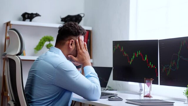 Indian trader or stock market broker or investor got frustrated while trading due to market crash or loss - concept of recession, risk management and bankrupt