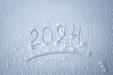 Date 2024 written on white texture snow
