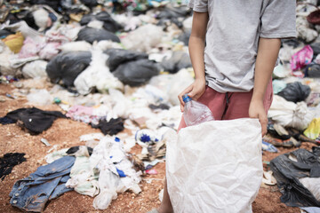 Child labor. Children are forced to work on rubbish. Poor children collect garbage. Poverty,...
