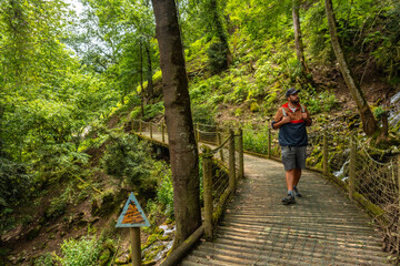Obraz premium A male hiker on a mountain trail in the Borce commune of the French Pyrenees