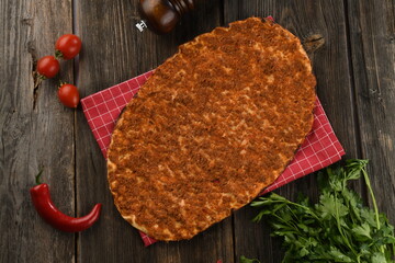 Fresh Antep Lahmacun on wooden board
