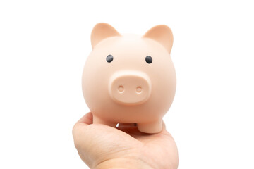 Piggy Bank on palm of hand with isolated background. Financial concept.