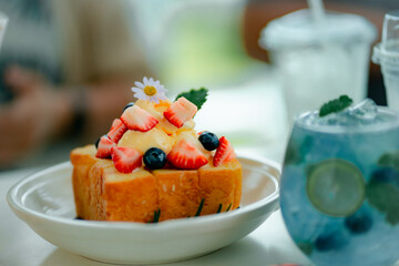 French cinnamon toast with blueberries, raspberries, maple syrup and coffee. morning breakfast, honey toast.