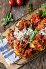 Eggplants filled with brown rice, tuna and tomato sauce. Oven baked with parmesan cheese