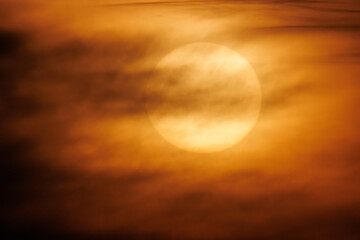 spectacular sun behind the clouds by sunset
