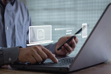 Transfer file concept. data transfer between Laptop and Smartphone. Data transfer file between folder, Backup data, Exchange of file. Virtual document loading to another folder. Streaming download.