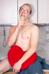 Young sexy guy in the kitchen.