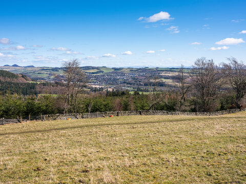 In March, a sunny distant view of the township of Selkirk on a walk on the Philiphaugh Estate, Selkirk, Scotland
