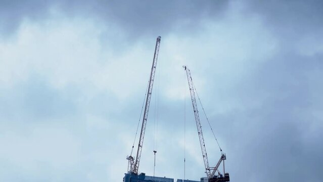 Time lapse of crane moving at a construction site.