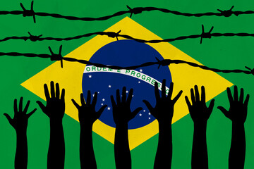 Brazil flag behind barbed wire fence. Group of people hands. Freedom and propaganda concept