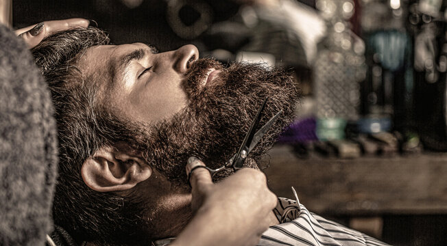 Barber scissors, barber shop. Vintage barbershop, shaving. Man hairstylist. Beard man in barbershop