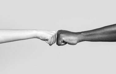 Black African American race male and woman hands giving a fist bump, multiracial diversity,...