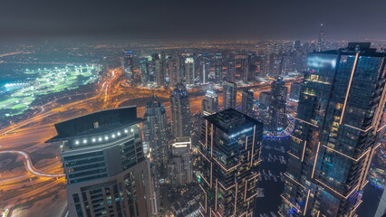 Fototapeta na wymiar Panorama of Dubai Marina with JLT skyscrapers day to night timelapse, Dubai, United Arab Emirates.
