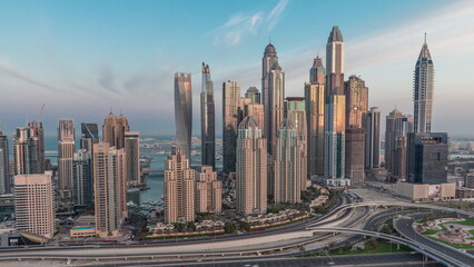 Naklejka na ściany i meble Dubai Marina highway intersection spaghetti junction night to day timelapse