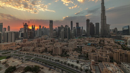 Naklejka na ściany i meble Sunset over Dubai Downtown timelapse with tallest skyscraper and other towers
