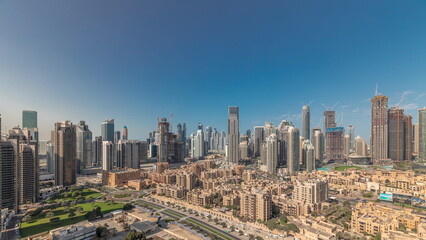 Fototapeta na wymiar Panorama showing Dubai's business bay towers aerial morning timelapse. Rooftop view of some skyscrapers