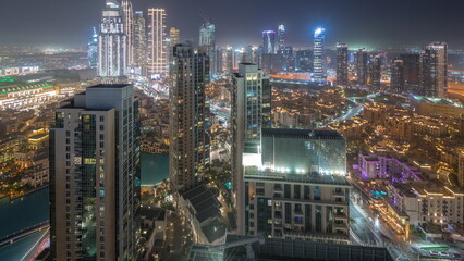 Aerial view of a big futuristic city day to night timelapse. Business bay and Downtown